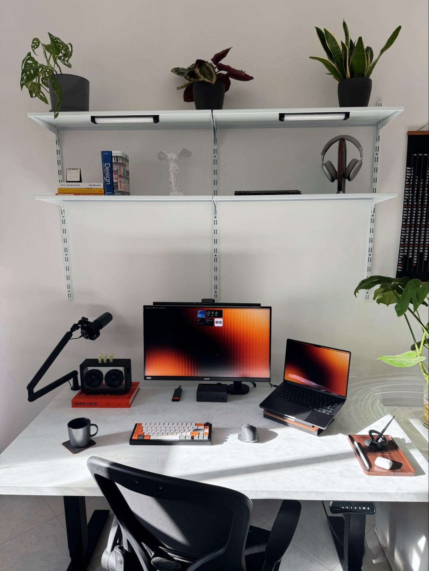 A minimal white desk setup with a WOODCESSORIES wooden tray